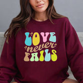 Love Never Fails | Retro Faith Statement Sweatshirt