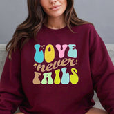 Love Never Fails | Retro Faith Statement Sweatshirt - Luckets.com