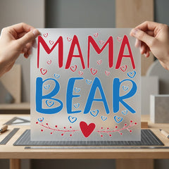 Mama Bear script design with three hearts on a comfortable grey crewneck sweatshirt.