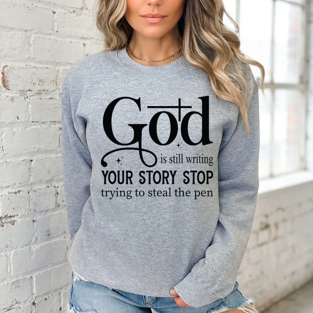 God Is Still Writing | Faith Story Sweatshirt - Luckets.com